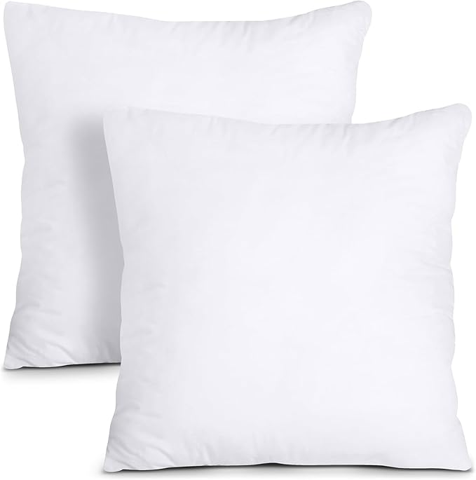 Two plain white pillow inserts, designed for use with decorative pillow covers, placed against a white background. no-save