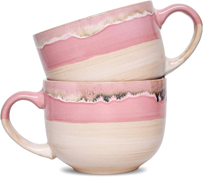 A set of two large pink ceramic coffee mugs with a rustic, elegant design, perfect for cozy mornings or romantic evenings. no-save