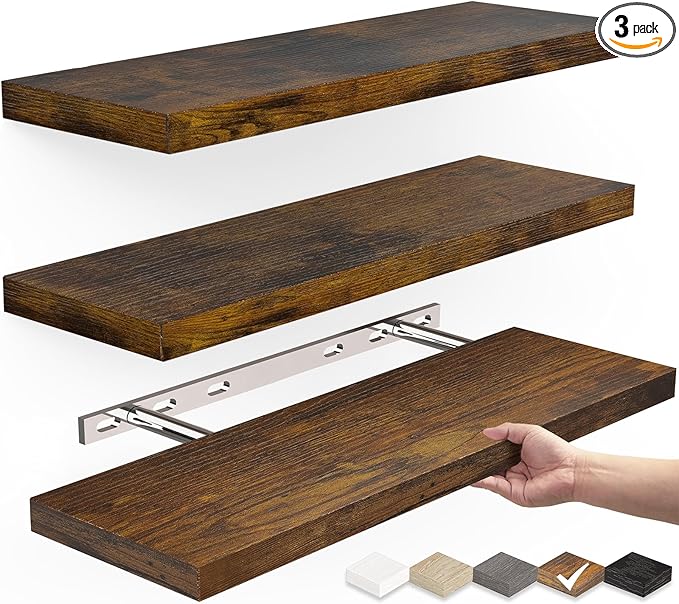  A set of three floating wooden shelves with a dark brown finish, shown in an exploded view with a hidden metal mounting bracket for easy installation. A hand is holding one shelf to demonstrate assembly, highlighting the sturdy and minimalist design suitable for modern home decor. no-save